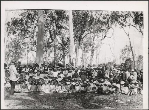 A.H. Chisholm talking about birds to bush children in Queensland, 1922 [picture]
