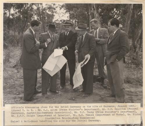 Officials discussing plans for the initial ceremony on the site for the Australian American Memorial in Canberra, January 1953 [picture]