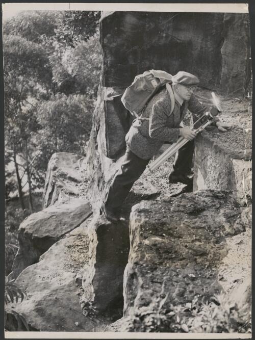 Frank Hurley climbs a rocky face in the Blue Mountains of New South Wales [picture]