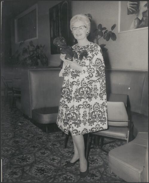 Adelie Hurley holding a Maori artefact [picture]