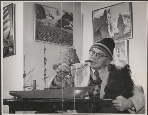Frank Hurley working on a model ship [picture]