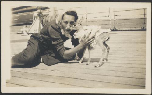Kira Abricossova and 'Aden' the gazelle on board the Maloja, September, 1938 [picture] / Patricia Mary Cape