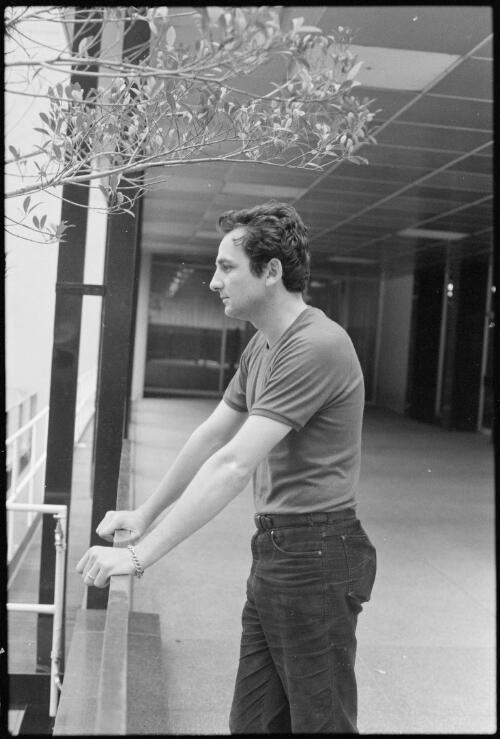 Portrait of Louis Nowra, author, leaning on a railing, 1981 [picture] / H de Berg