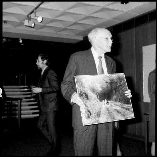 Portrait of Norman Deck with one of his photographs, National Library of Australia, Canberra, 3 October 1972 [picture]