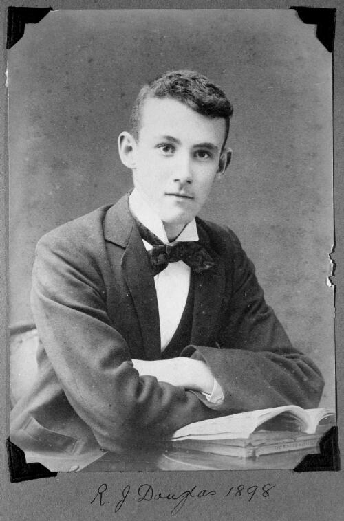 Portrait of Robert Johnstone Douglas at a desk, 1898 [picture]