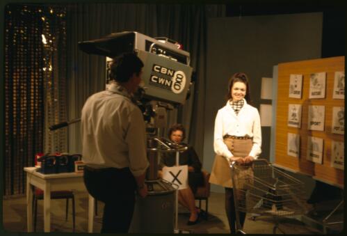 Australian television presenter Sue Smith and cameraman Peter Webster during rehearsals at the CBN 8 and CWN 6 television studios, Orange, New South Wales, October 1968 [transparency] / Stephen Fleay