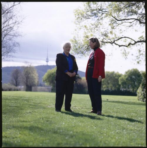 Portrait of Trisha Dixon with Judith Baskin on the lawns near the National Library of Australia, Canberra, 26 September 1996 [transparency] / Loui Seselja