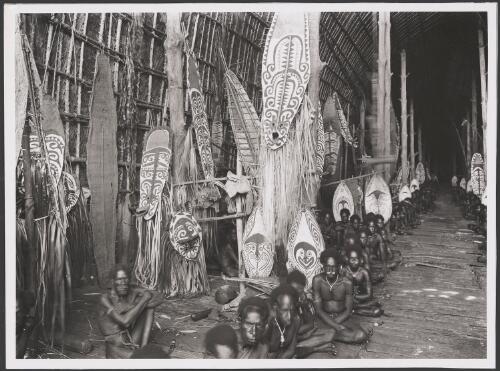 Men in two lines inside the great kau ravi of Kaimari, gulf of Papua, New Guinea, ca. 1920s [picture] / Frank Hurley