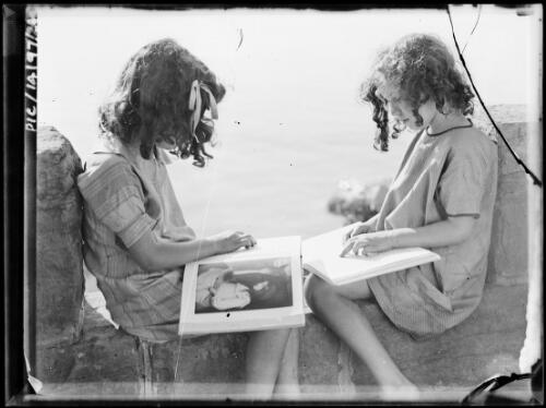 Portrait of Toni and Adelie Hurley reading, ca. 1929 [picture] / Frank Hurley