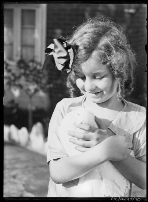 Portrait of Toni Hurley holding a dove, ca. 1928, 2 [picture] / Frank Hurley
