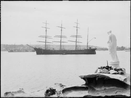A barque, Lisbeth, on Sydney Harbour, with a statue in the foreground, 1927, 1 [picture] / Frank Hurley