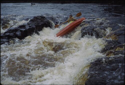 Olegas Truchanas in his kayak, Huon River, southwest Tasmania, 1962?, 2 [transparency] / Peter Dombrovskis