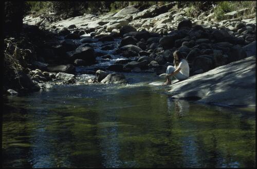 North West Bay River and unidentified female, Mount Wellington, Tasmania, 1969? [transparency] / Peter Dombrovskis