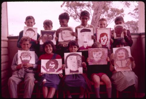 Self-portrait paintings by Murrin Bridge Aboriginal School students, New South Wales, 3 August 1962 [transparency] / Phil Wilding