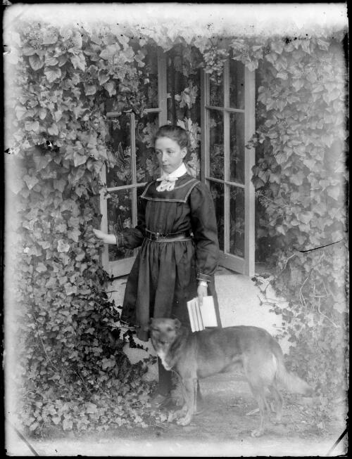 May De Salis with dog in the garden, Cuppacumbalong, Australian Capital Territory, ca. 1893 [picture]