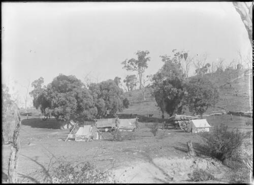 Campsite of tents and wagon at the base of a hill, Naas or Cotter property [?], Australian Capital Territory, ca. 1900 [picture]