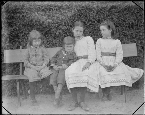 Emily, Rodolph, Charlotte and May De Salis sitting on a garden bench, Cuppacumbalong, Australian Capital Territory, ca. 1890 [picture]