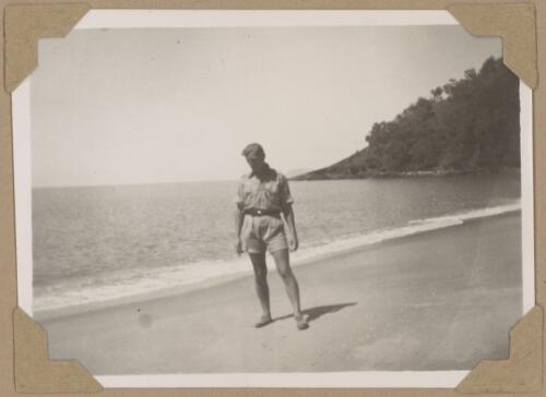 Bert looking for shells on Trinity Beach, Queensland, August 1945 [picture] / Alfred Amos