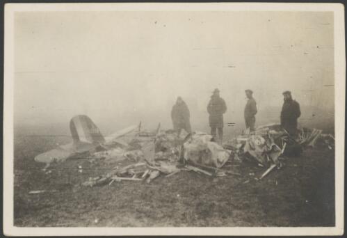 Four men examining the wreckage of a crashed R.E.8, B-2259, biplane that killed Lieutenant Donohue, France, 1917 [picture] / John Joshua