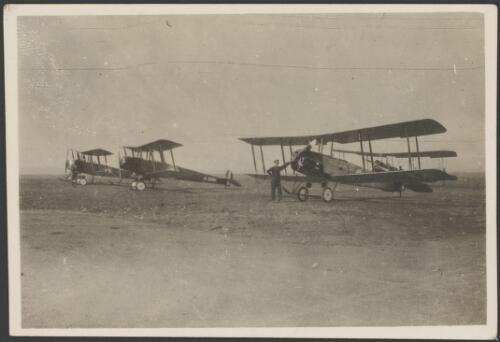 Three Avro 504J training biplanes lined up on an airfield, England, 1917 [picture] / John Joshua