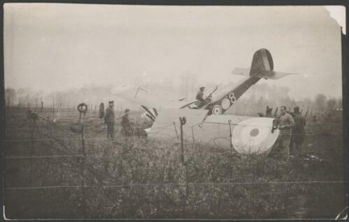 A 3 Squadron, Australian Flying Corps, Royal Aircraft Factory RE8 biplane crashed nose down in barbed wire, France, 1917 [picture] / John Joshua