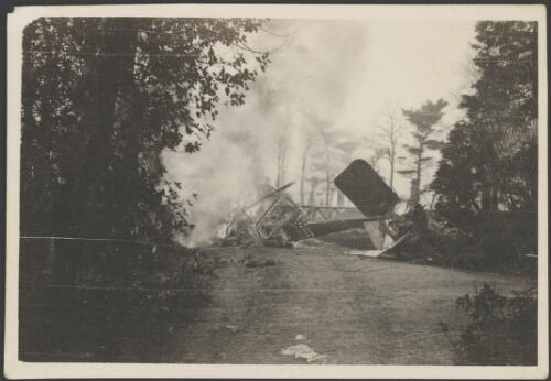 Burning wreckage of a military biplane, Bailleul, France, 1917 [picture] / John Joshua