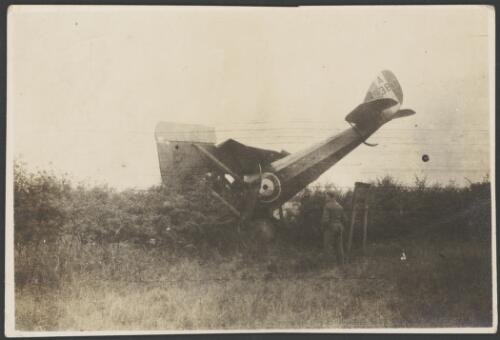 A soldier examining the crashed Airco DH.5, A-9383, biplane, England, 1917 [picture] / John Joshua