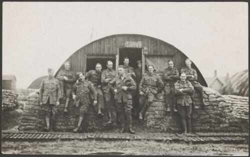 Group portrait of the members of the transport section of 3 Squadron, Australian Flying Corps, in front of a Nissen hut, Villers-Bretonneux, France, 1918 [picture] / John Joshua