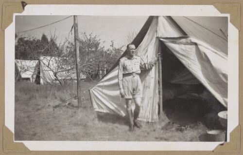 Alfred Amos standing outside of a tent at the bush camp at Pemberton [?], Western Australia, October 1946 [picture]