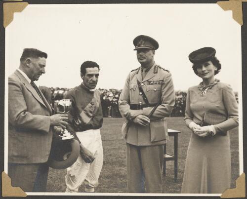 Duke and Duchess of Gloucester present the Melbourne Cup to the winning owner and jockey of Russia, at Flemington Racecourse, Melbourne, November 1946 [picture] / Herald Feature Service