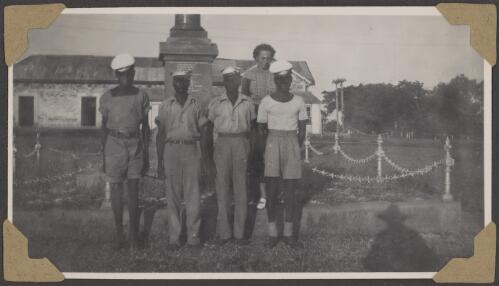 Dorothy Amos with four local men in uniform, Darwin, Northern Territory, January 1947 [picture] / Alfred Amos