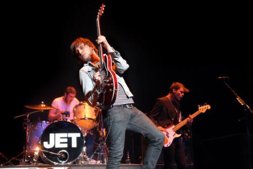 Chris Cester on drums, Nic Cester lead singer and Mark Wilson bass guitarist of rock band Jet, performing at the Rod Laver Arena, Melbourne, 14 December 2009 [picture] / Martin Philbey