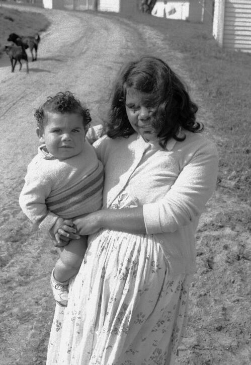 A young Aboriginal mother holding her infant at Lake Tyres Mission, Victoria, ca. 1965 [picture] / Albert W. Brown