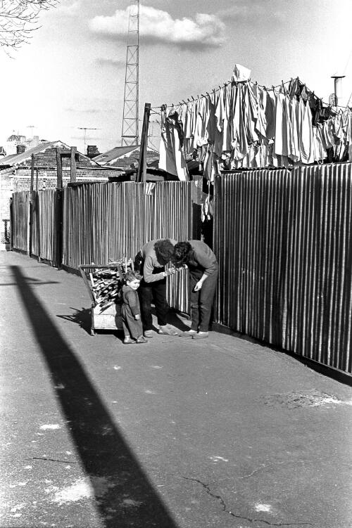 Two women with a toddler in a street, Carlton, Victoria, ca. 1965 [picture] / Roy McDonald