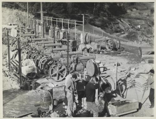 Men at Geehi Dam works area installing compressors and substation, Snowy Mountains, New South Wales,1964? [picture] / Thiess Bros Pty Ltd
