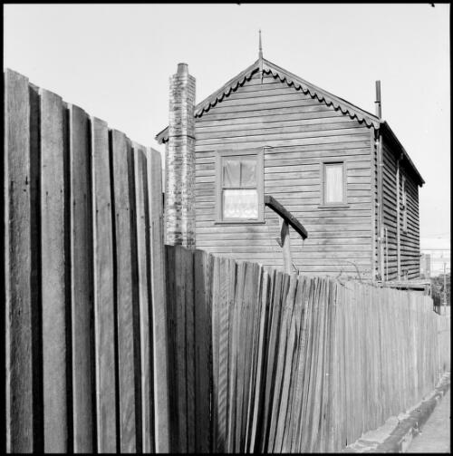 Rear view of two storey weatherboard house, Balmain, New South Wales, ca. 1970 [picture] / Wes Stacey
