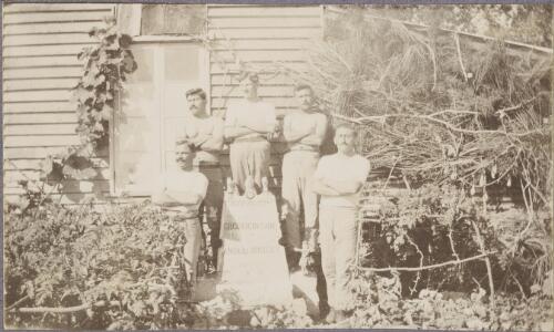 Five Croatian [?] internees standing behind a memorial stone in a vegetable garden, Rottnest Island, Western Australia, ca. 1915 [picture] / Karl Lehmann