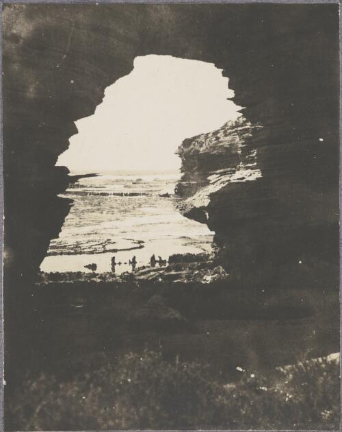 View through a rock arch on the west cape, Rottnest Island, Western Australia, ca. 1915, 2 [picture] / Karl Lehmann