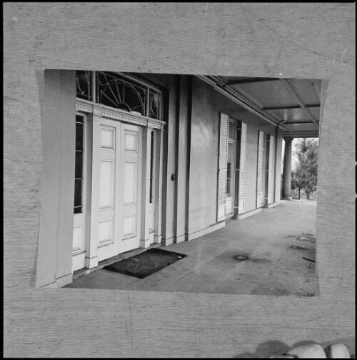 Entrance door with Georgian fanlight, shuttered French windows and a verandah with doric columns, The Vineyard, near Parramatta, New South Wales, ca. 1970 [picture] / Wes Stacey