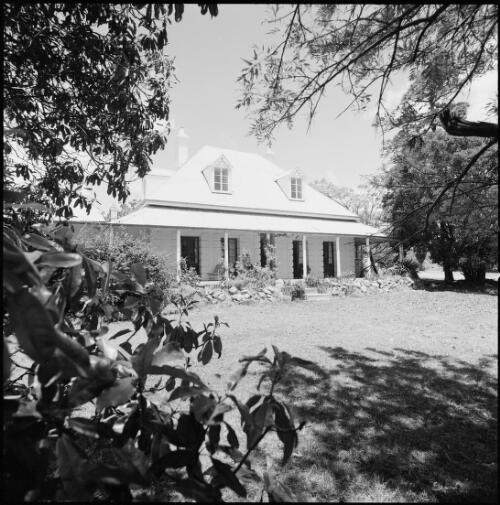 Elevated angled view from garden of stucco homestead, New South Wales, ca. 1970 [picture] / Wes Stacey