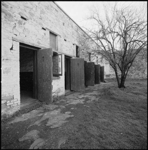 Prisoners' cells and exercise yard, Redruth Gaol, Burra, South Australia, ca. 1970 [picture] / Wes Stacey