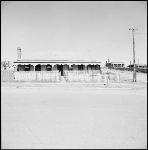 Front of single storey timber hotel with picket fences, Gulgong, New South Wales, ca. 1970 [picture] / Wes Stacey