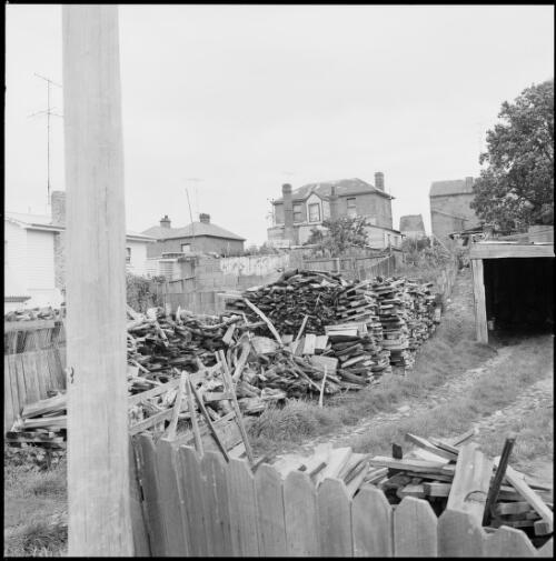 Woodpiles and houses, Oatlands, Tasmania, ca. 1970 [picture] / Wes Stacey