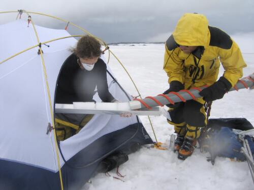 Dr Martin Truffer passing ice core samples to glaciologist Shavawn Donoghue, Brown Glacier, Heard Island, Antarctica, January 2004 [picture] / Doug Thost