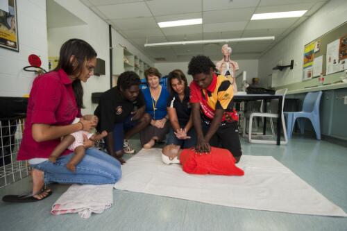 Students from the Aboriginal and Torres Straits Primary Health Care, learning CPR first aid at the Batchelor Institute, Northern Territory, 6 August 2010 [picture] / Darren Clark
