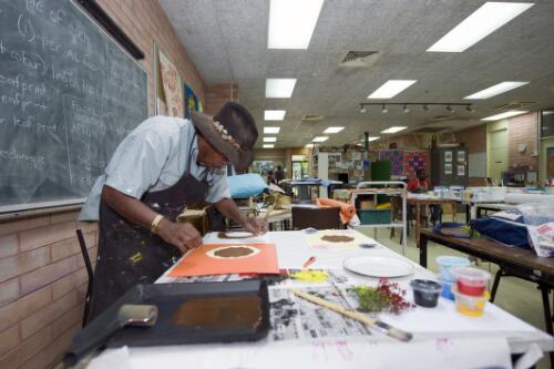 Student teacher David Simpson screen printing, at the Batchelor Institute of Indigenous Tertiary Education, Northern Territory, 4 August 2010 [picture] / Darren Clark