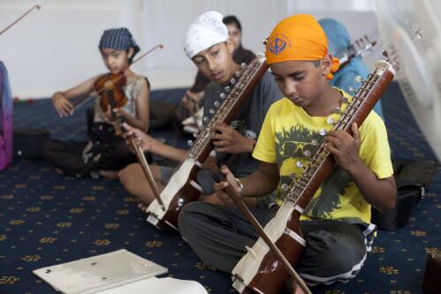 Three boys with musical instruments participating in Sikh community classes at the Glenwood Gurdwara, Glenwood, New South Wales, 13 November 2010, New South Wales, 2010 [picture] / Louise Whelan