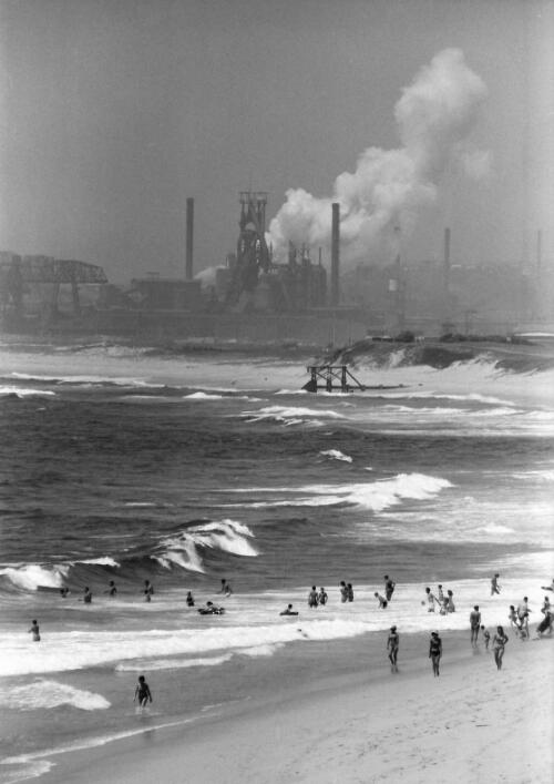 Beach at Wollongong looking south towards the steel works in Port Kembla, 1966 [picture] / Robert McFarlane
