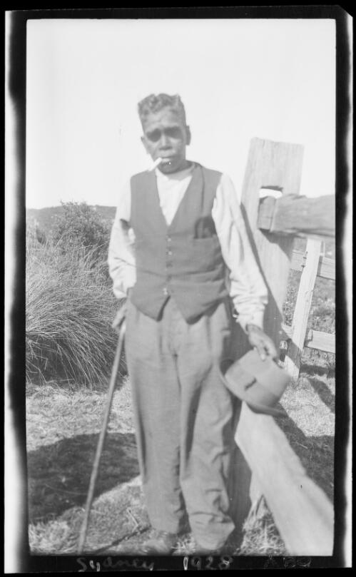 Aboriginal man holding a walking stick and his hat, Sydney, 1928