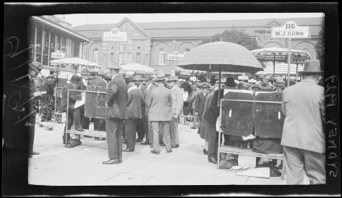 Crowd at bookmaker stalls outside the Randwick Racecourse tote building, Sydney, 1 April 1929